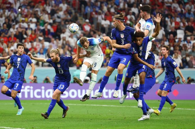 England striker Harry Kane heads at goal.