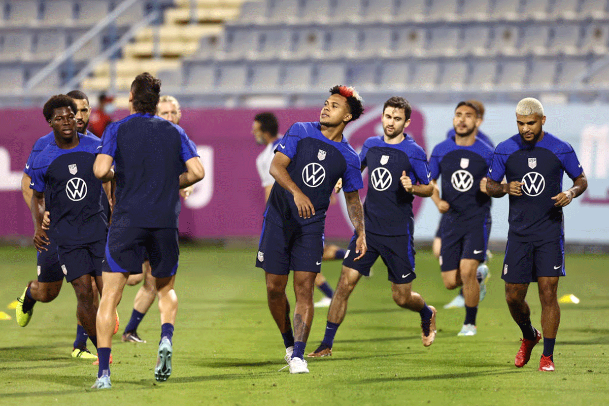 USA's Weston McKennie warms up with teammates during the United States Training Session at Al Gharafa Stadium in Doha, Qatar. 