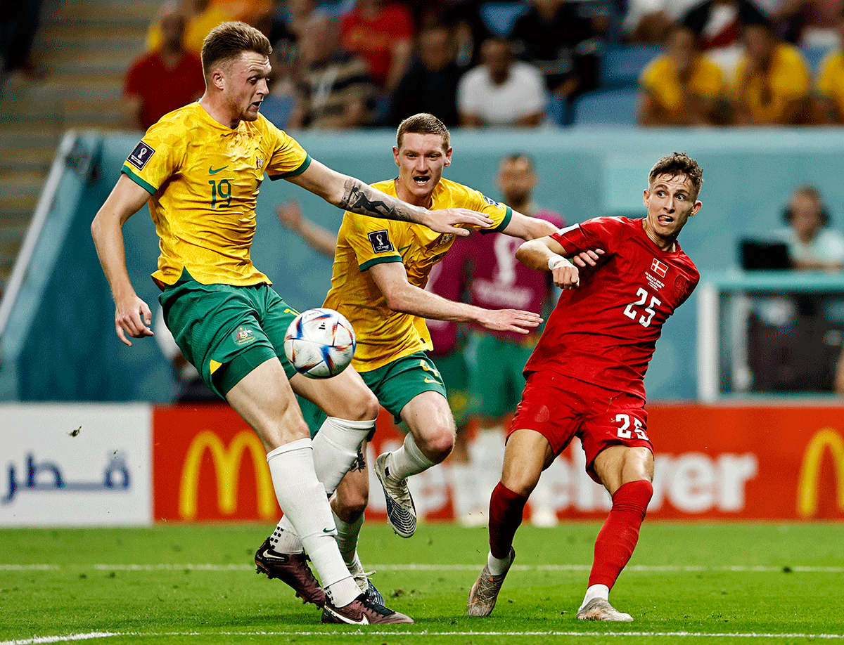 Australia's Harry Souttar in action with Denmark's Jesper Lindstrom