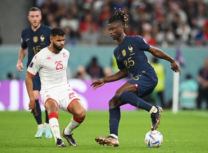 Eduardo Camavinga of France controls the ball against Anis Ben Slimane of Tunisia 