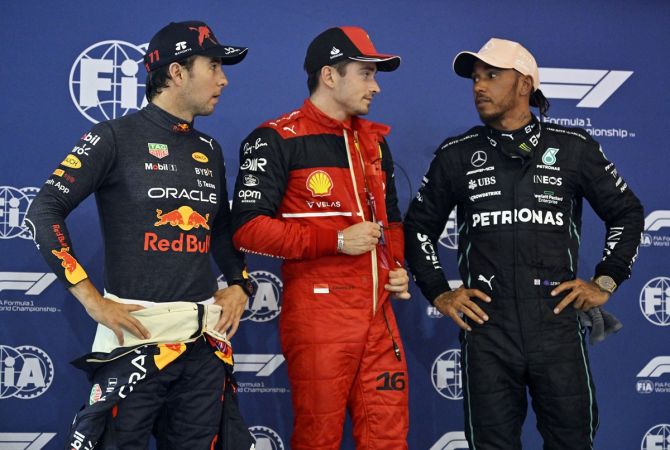 Ferrari's Charles Leclerc, Red Bull's Sergio Perez and Mercedes's Lewis Hamilton after qualifying in first, second and third places respectively in the Singapore Grand Prix, at Marina Bay Street Circuit, on Saturday.