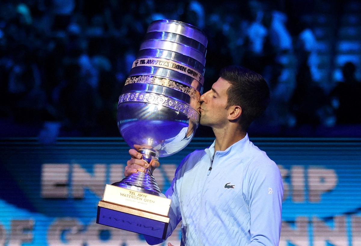 Novak Djokovic poses with the trophy after defeating Croatia's Marin Cilic in the final of the Tel Aviv Open on Sunday.