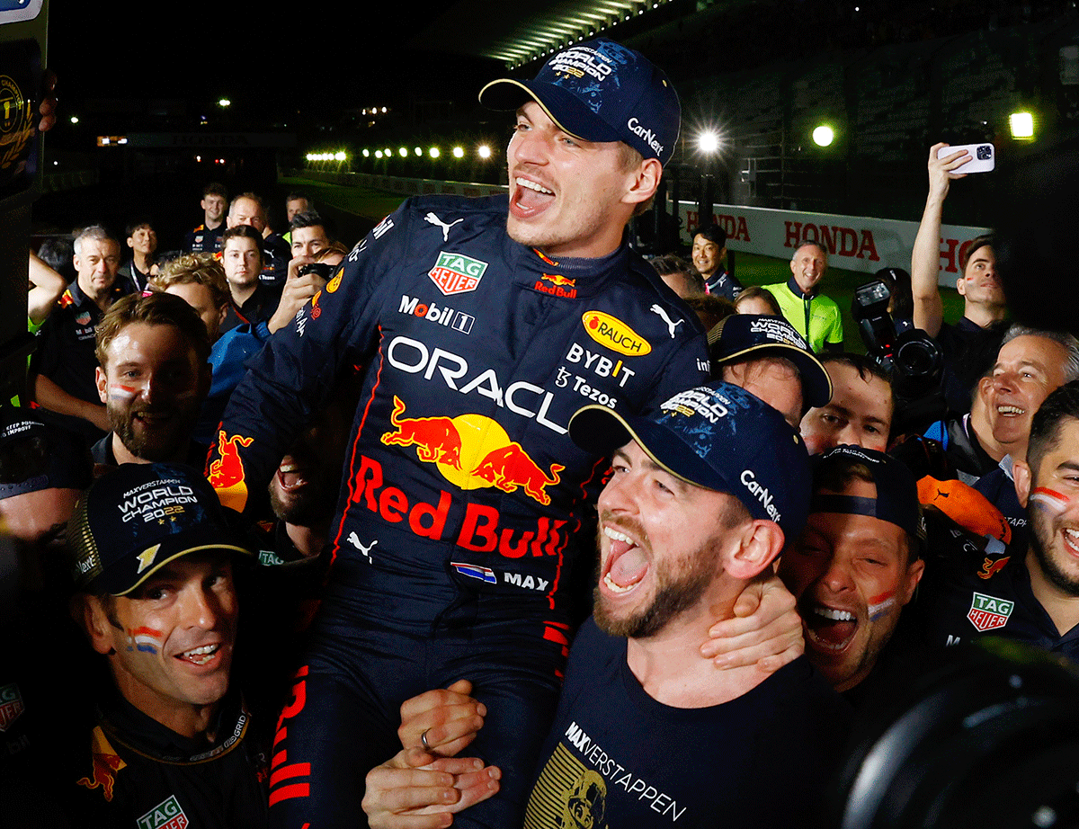 Red Bull's Max Verstappen celebrates winning the Japanese Grand Prix race and the championship with his team at the Suzuka Circuit, Suzuka, Japan on Sunday.