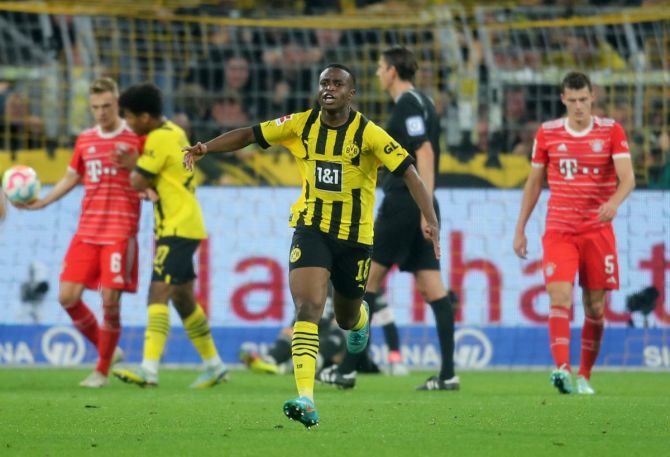 Youssoufa Moukoko celebrates scoring Borussia Dortmund's goal Bayern Munich in the Bundesliga match at Signal Iduna Park, Dortmund, Germany.