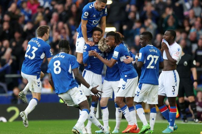 Everton's Anthony Gordon celebrates scoring their second goal with teammates