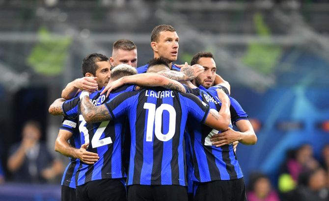 Edin Dzeko celebrates scoring Inter Milan's third goal with teammates during the Champions League Group C match against Viktoria Plzen, at San Siro, Milan, Italy.