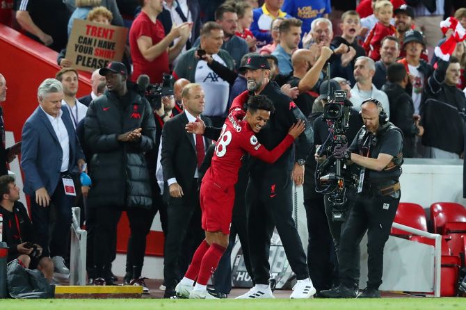Fabio Carvalho gets a hug from manager Juergen Klopp, after scoring the match-winner for Liverpool against Newcastle United in stoppage time at Anfield, Liverpool.