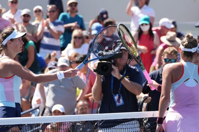 Belarus's Victoria Azarenka, left, and Ukraine's Marta Kostyuk exchange a quick tap of the racket after their second round match on Thursday, Day 4 of the 2022 US Open.