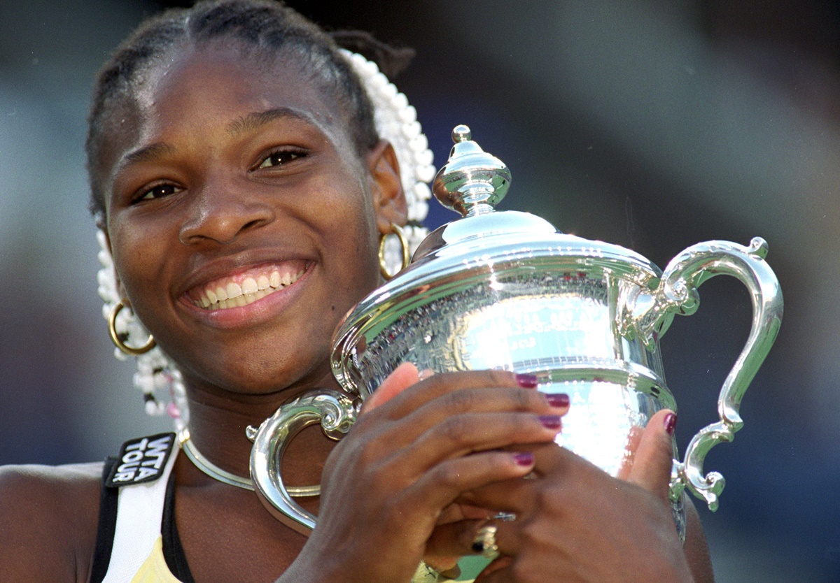 Serena Williams poses with her maiden Grand Slam trophy after defeating Switzerland's Martina Hingis in the US Open final on September 11. 1999.