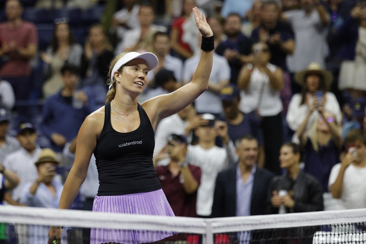 Danielle Collins of the United States waves to the crowd after her match against France's Alize Cornet.