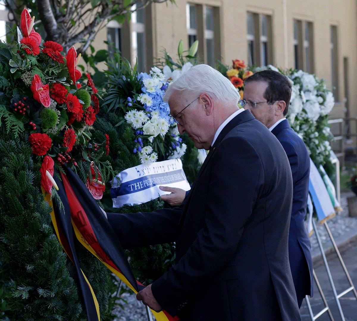 German President Frank-Walter Steinmeier and Israeli President Isaac Herzog adjust a wreath during a ceremony, commemorating the 50th anniversary of the attack in Fuerstenfeldbruck near Munich, Germany, on Monday, September 5, 2022. 