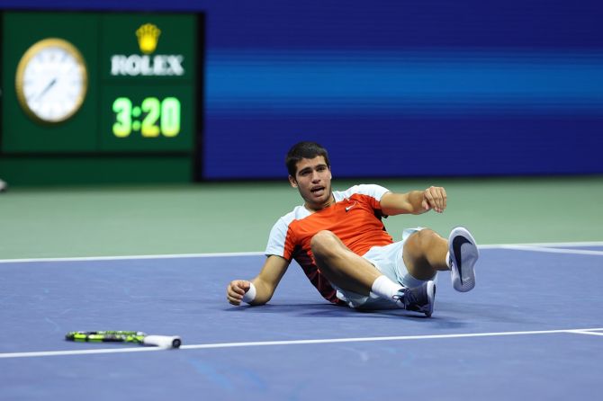 Spain's Carlos Alcaraz drops to the ground in celebration after serving an ace and defeating Norway's Casper Ruud in the US Open men’s singles final at Billie Jean King National Tennis Center, New York City, on Sunday.