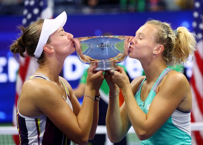 The Czech Republic's Katerina Siniakova and Barbora Krejcikova celebrate with the trophy after winning the US Open women's doubles final against Caty McNally and Taylor Townsend of the United States on Sunday.