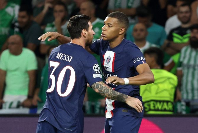 Kylian Mbappe celebrates with Lionel Messi after scoring Paris St Germain's second goal in the Group H match against Maccabi Haifa, at Sammy Ofer Stadium, Haifa, Israel.