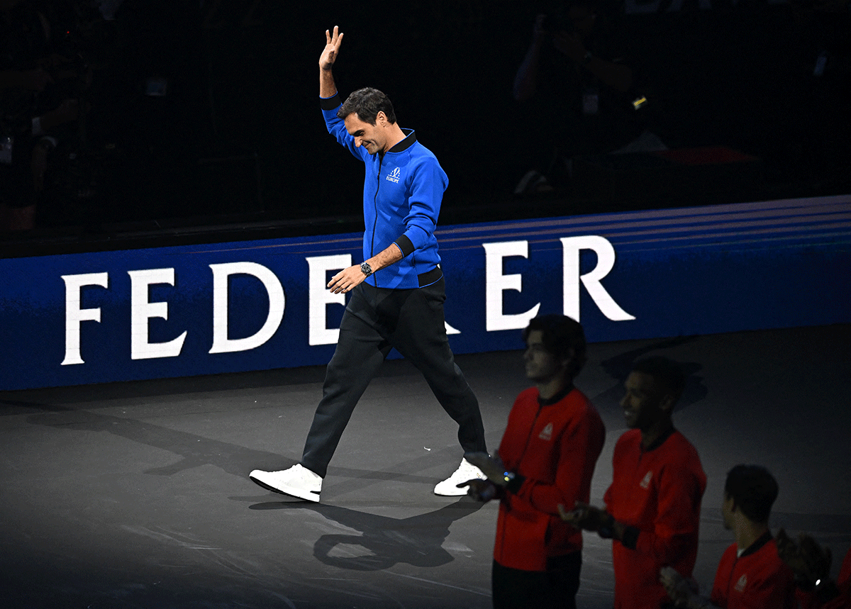Team Europe's Roger Federer walks onto the court ahead of Andy Murray's match against Team World's Alex de Minaur on Friday