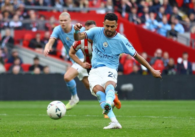 Riyad Mahrez scores Manchester City's opening goal from the penalty spot in the FA Cup semi-final against Sheffield United at Wembley Stadium, London, on Saturday.