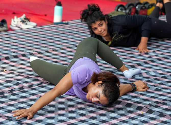 Vinesh Phogat and Sakshi Malik exercise ahead of their sit-in protest on Thursday