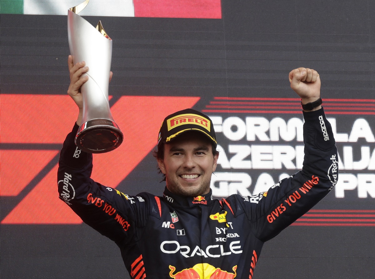 Red Bull's Sergio Perez celebrates with the trophy on the podium after winning the Azerbaijan Grand Prix, at Baku City Circuit, Azerbaijan, on Sunday.