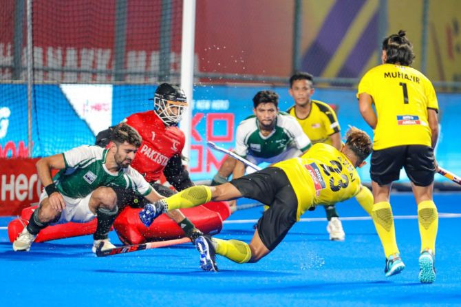 Malaysia's Firhan Ashari converts a penalty corner against Pakistan