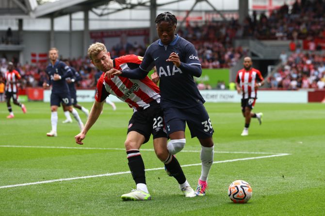Tottenham Hotspur's Destiny Udogie and Brentford's Nathan Collins vie for the ball 
