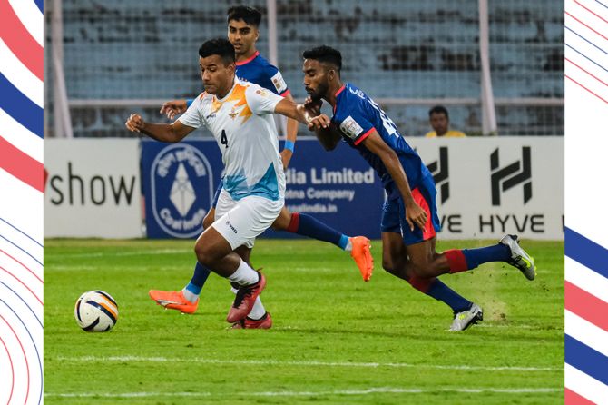 Players of Indian Air Force FT and Bengaluru FC vie for the ball
