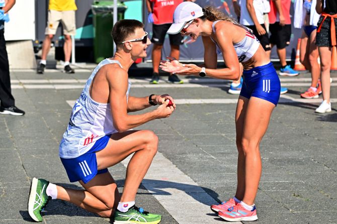 Slovakia's Dominik Cerny proposes to Slovakia's Hana Burzalova after the 35km race walk at Heroes Square, during the 2023 World Athletics Championships in Hungary, Budapest on Thursday. 