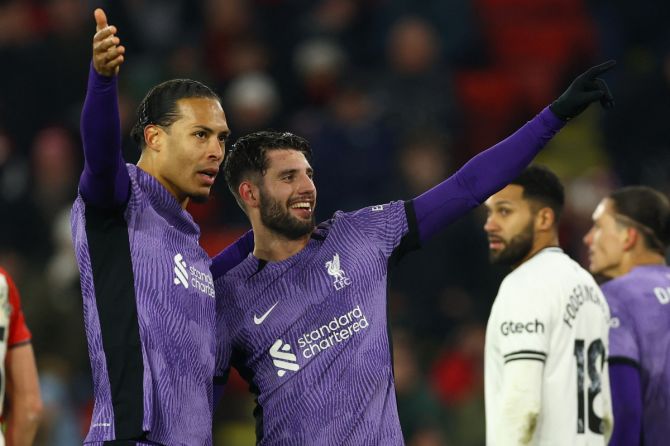 Liverpool's Dominik Szoboszlai celebrates with Virgil van Dijk after scoring their second goal against Sheffield United 