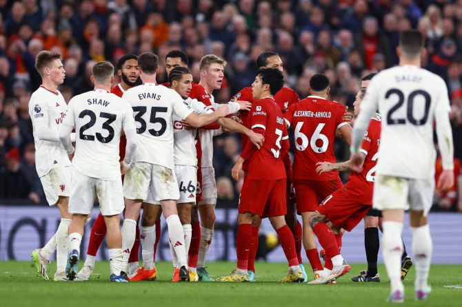Liverpool and Manchester United players clash 
