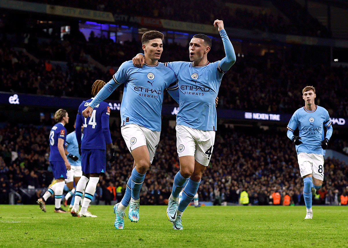Manchester City's Julian Alvarez celebrates scoring their second goal with Phil Foden during their FA Cup Third Round match at Etihad Stadium, Manchester on Sunday 