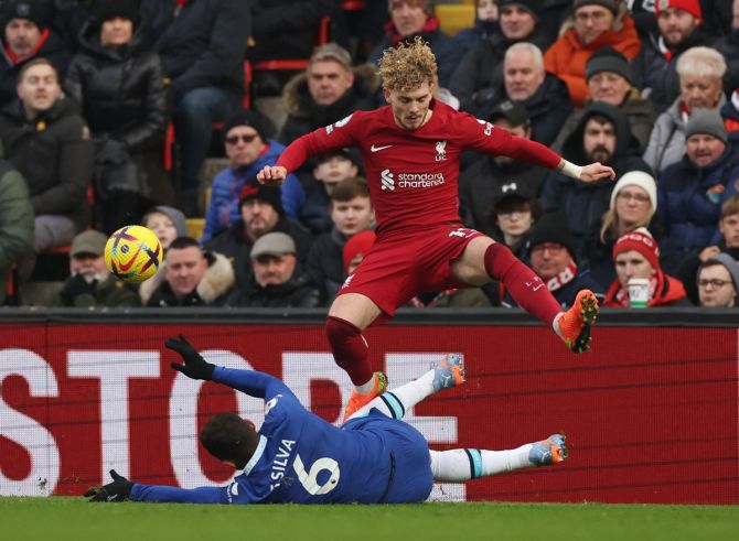 Liverpool's Harvey Elliott takes evasive action from a sliding tackle from Chelsea's Thiago Silva.