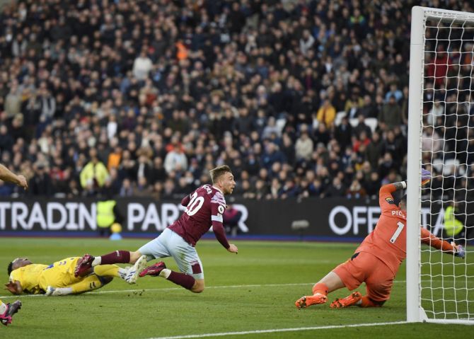 Jarrod Bowen scores West Ham United's second goal past Everton goalkeeper Jordan Pickford, at London Stadium.