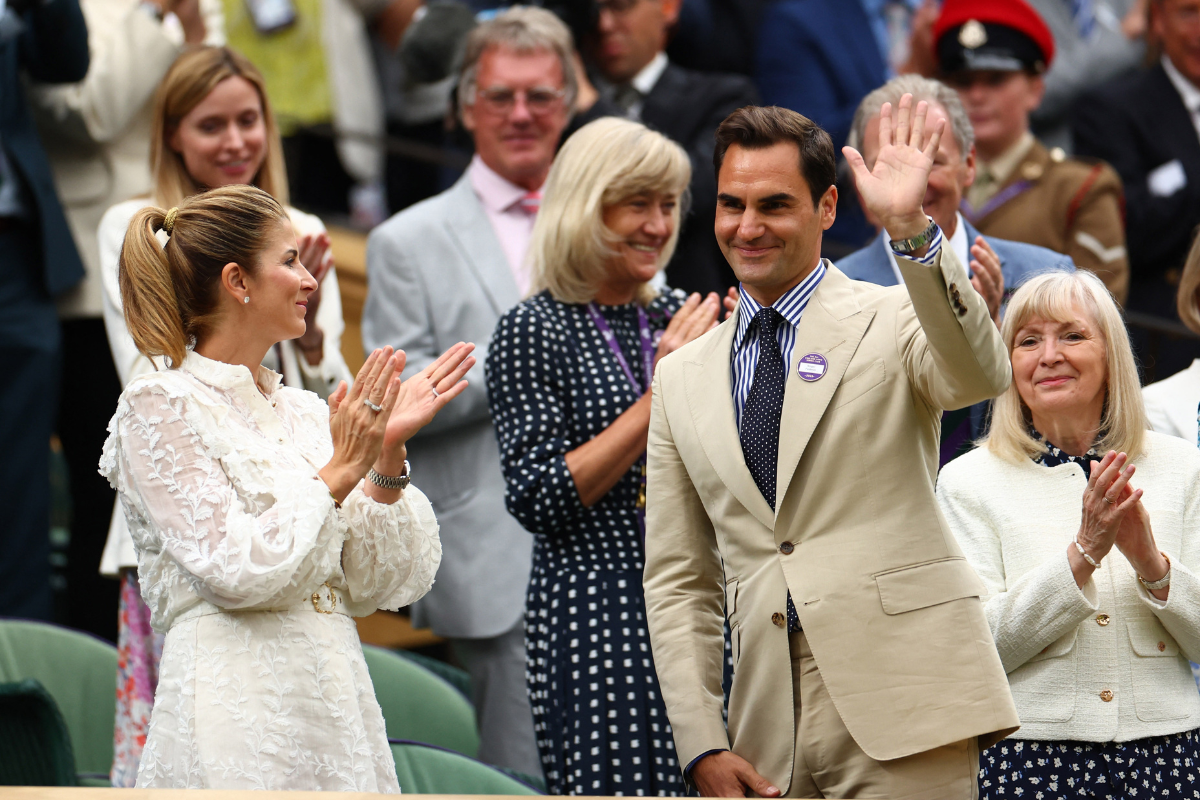 Eight-time Wimbledon champion Roger Federer acknowledges the crowd on centre court following a short film honouring his achievements at Wimbledon.