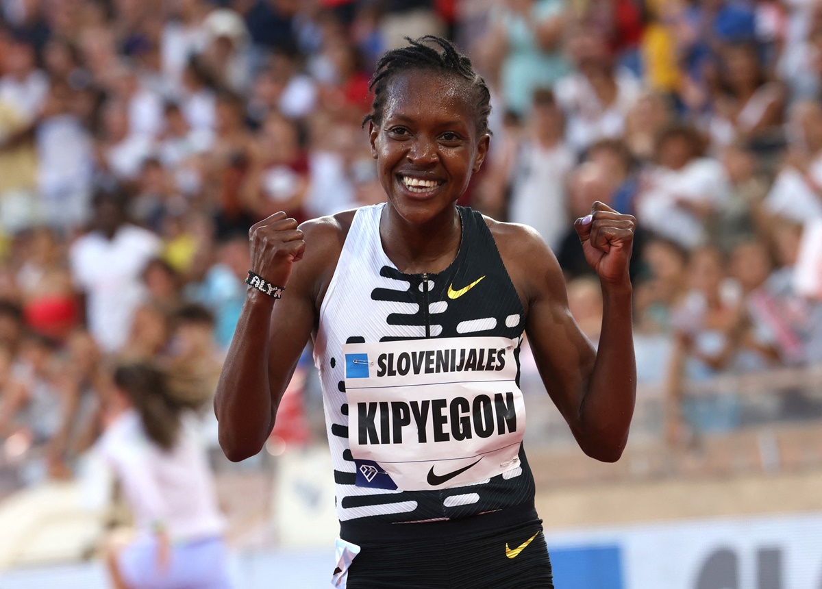Kenya's Faith Kipyegon celebrates after winning the women's 1 mile final at the Diamond League meet, at  Herculis - Stade Louis II, Monaco, on Friday.