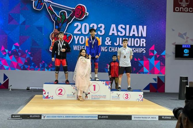 India's Bedabrat Bgarali on the podium after winning gold at the Asian Youth and Junior Weightlifting Championships in Greater Noida on Monday 