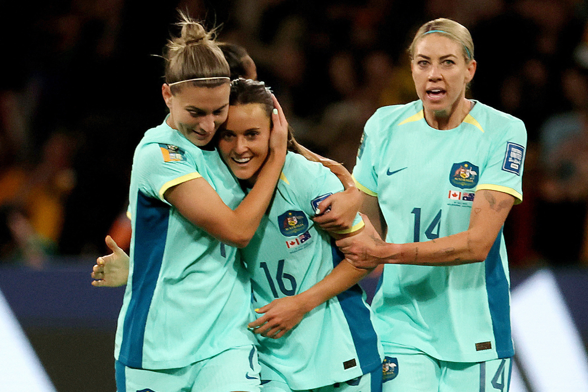 Australia's Hayley Raso celebrates scoring their first goal with Stephanie Catley and Alanna Kennedy