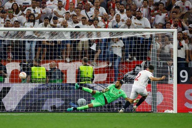 Sevilla's Gonzalo Montiel scores a penalty during the shoot-out to win the Europa League