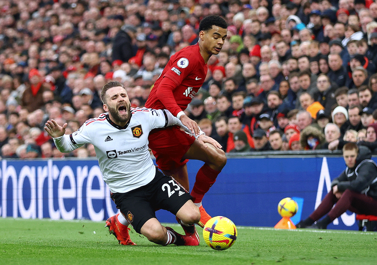 Manchester United's Luke Shaw is tackled by Liverpool's Cody Gakpo during their EPL match at Anfield on Sunday. 'We showed no personality, no mentality,' Shaw summed up United's performance.