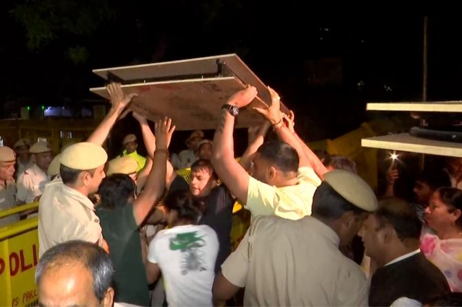 A scuffle breaks out between protesting wrestlers and Delhi Police at Jantar Mantar, in New Delhi on Wednesday