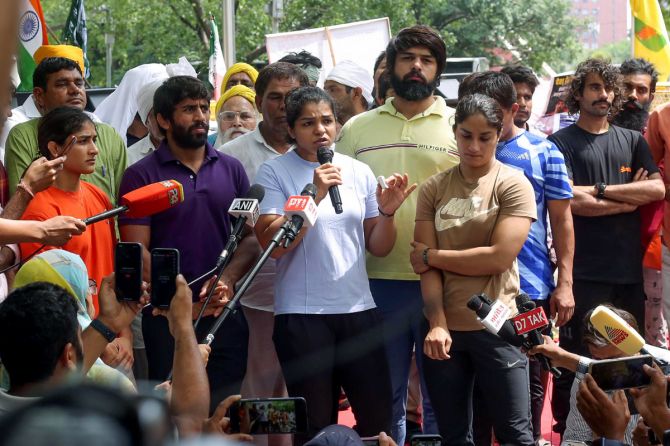 Wrestler Sakshi Malik addresses the media ahead of the protest march from Jantar Mantar to New Parliament House against the alleged sexual harassment of women wrestlers by WFI chief Brij Bhushan Sharan Singh, in New Delhi on Sunday. 
