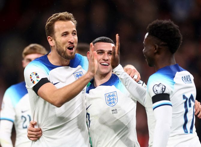 Harry Kane celebrates with Bukayo Saka and Phil Foden after scoring England's second goal during the Group C qualifier against Malta, at Wembley Stadium, London.