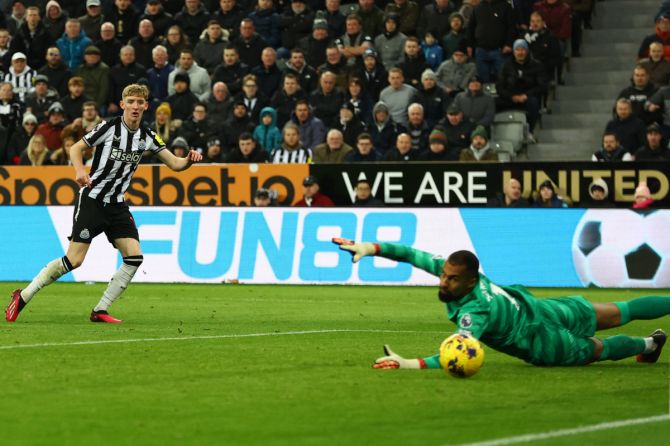 Newcastle United's Anthony Gordon scores their fourth goal against Chelsea during their match at  St James Park, Newcastle. 