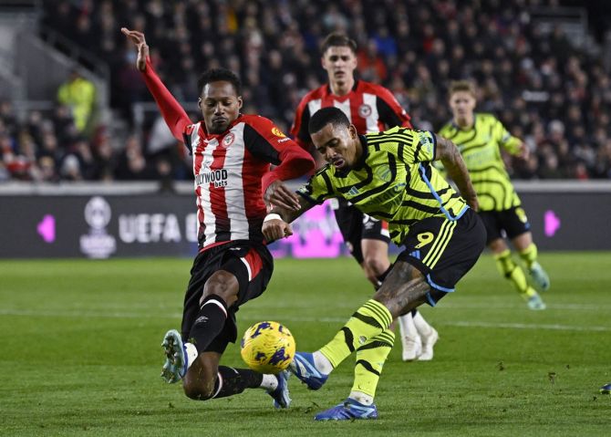 Arsenal's Gabriel Jesus is tackled by Brentford's Ethan Pinnock.