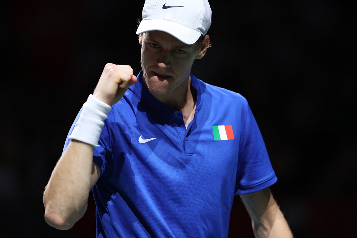 Jannik Sinner celebrates beating Novak Djokovic in the singles match. 