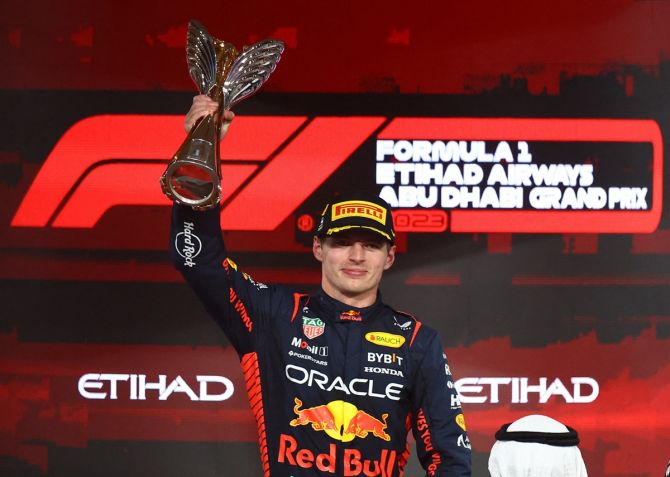 Red Bull's Max Verstappen celebrates with the trophy after winning the Formula One Abu Dhabi Grand Prix, at Yas Marina Circuit, Abu Dhabi, on Sunday.