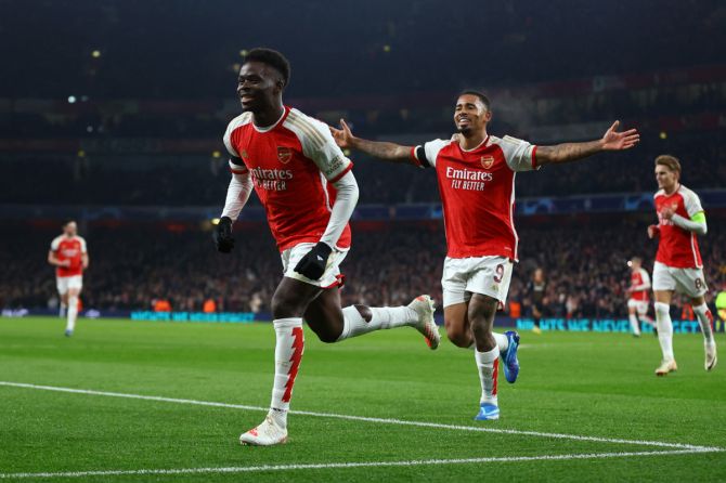 Arsenal's Bukayo Saka celebrates scoring their third goal with Gabriel Jesus 
