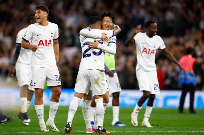 Tottenham Hotspur's Son Heung-min celebrates with Alejo Veliz and Pedro Porro celebrate after the match against Liverpool at London Stadium in London on Saturday