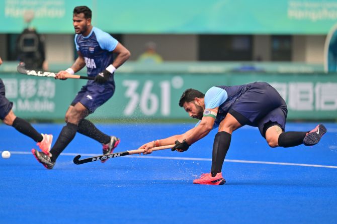 India captain Harmanpreet Singh scores the opening goal against Bangladesh in their fifth and final Pool A match at the Asian Games in Hangzhou on Monday