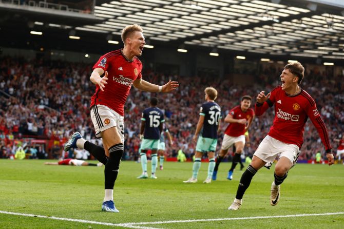 Manchester United's Scott McTominay celebrates scoring their second goal with Alejandro Garnacho in the match against Brentford at Old Trafford 