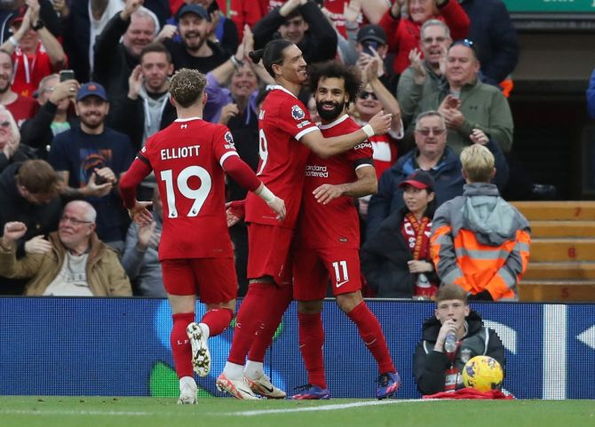 Mohamed Salah celebrates with Darwin Nunez and Harvey Elliott after scoring Liverpool's third goal in the Premier League match against Nottingham Forest, at Anfield, Liverpool, on Sunday.