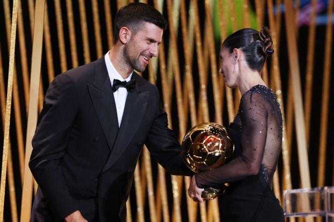 FC Barcelona's Aitana Bonmati receives the women's Ballon d'Or from Serbian tennis player Novak Djokovic 
